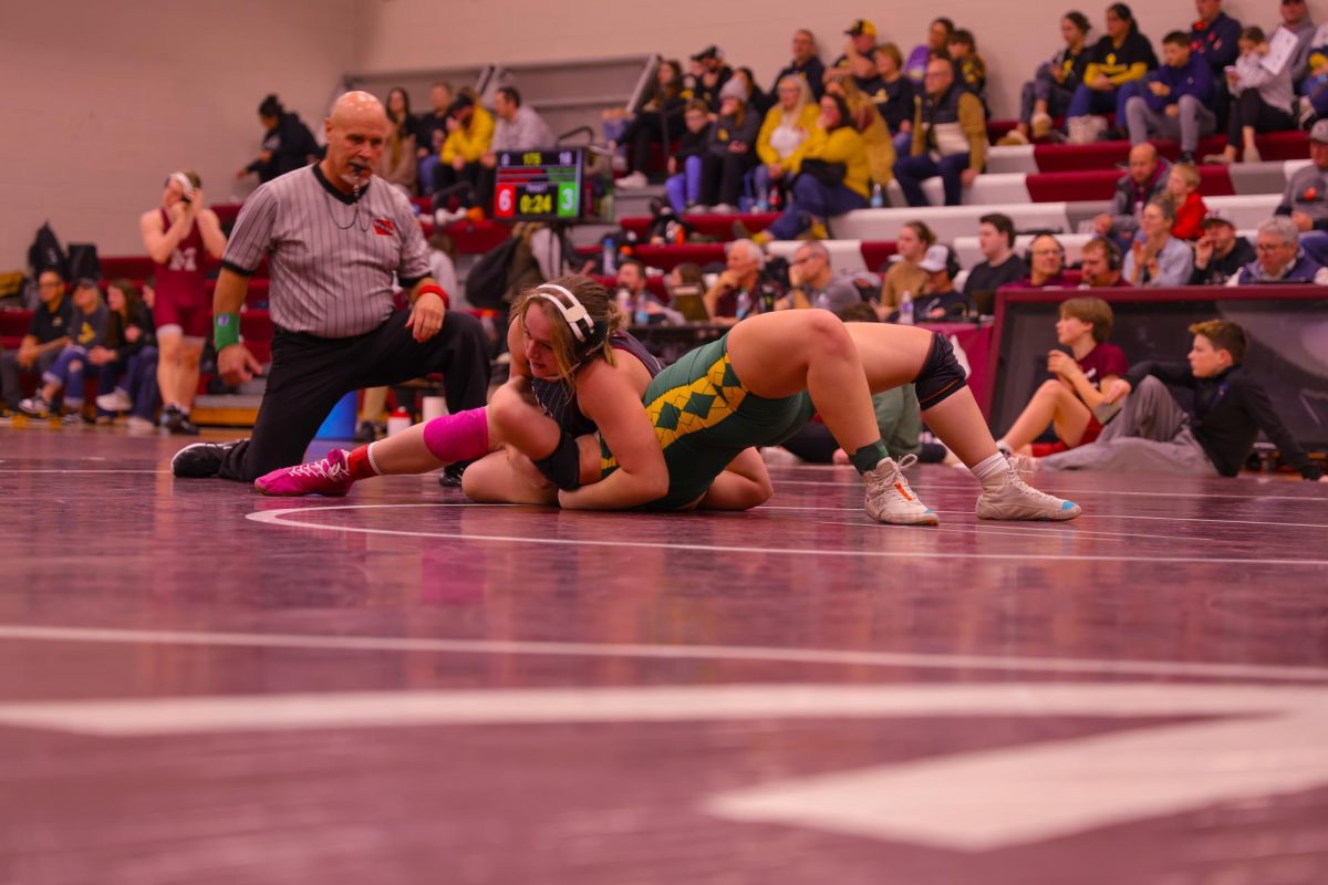 Junior Gracie Pinckney ranked #2 in 170lbs (Class 1A) holds her opponent down to secure her victory, Jan. 9. 