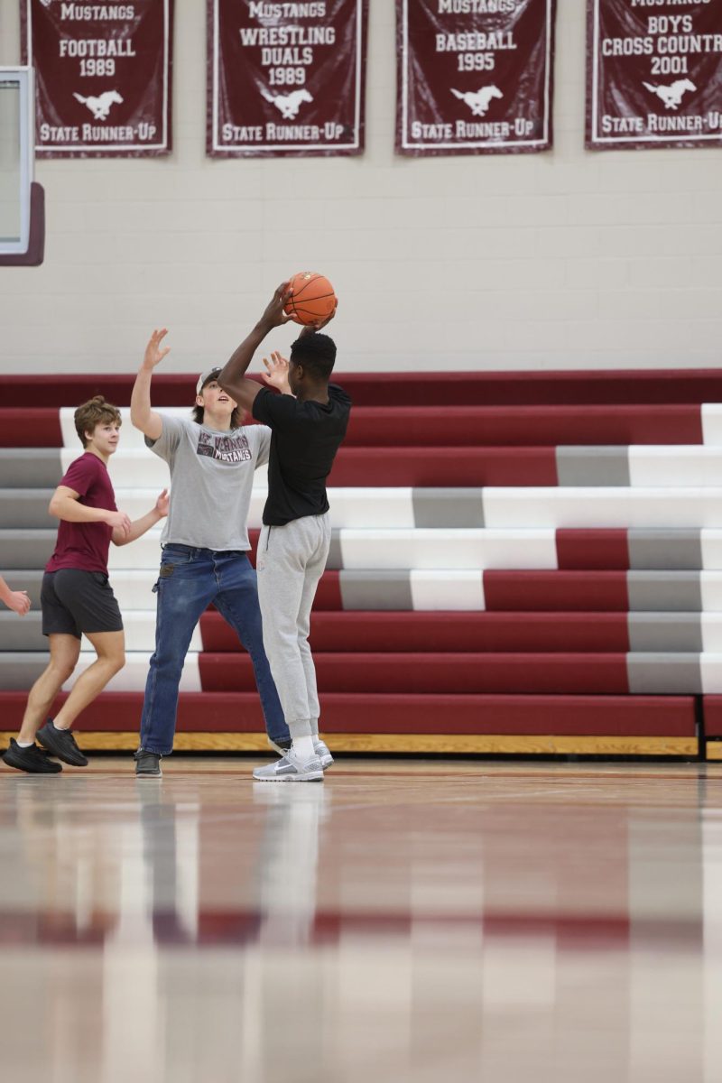 Senior Watson Krob looks to pass the ball to his teammate during their Exercise Science J-Term basketball game.