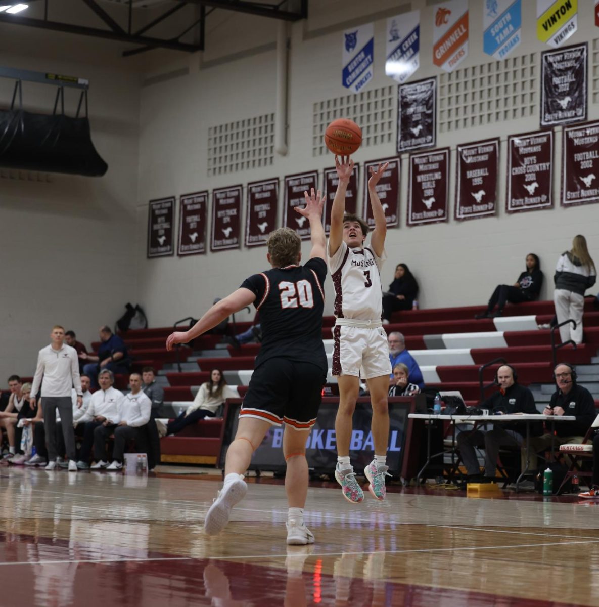 Sophomore Luke Rushford (3) jumps to shoot a three pointer Jan. 28. 