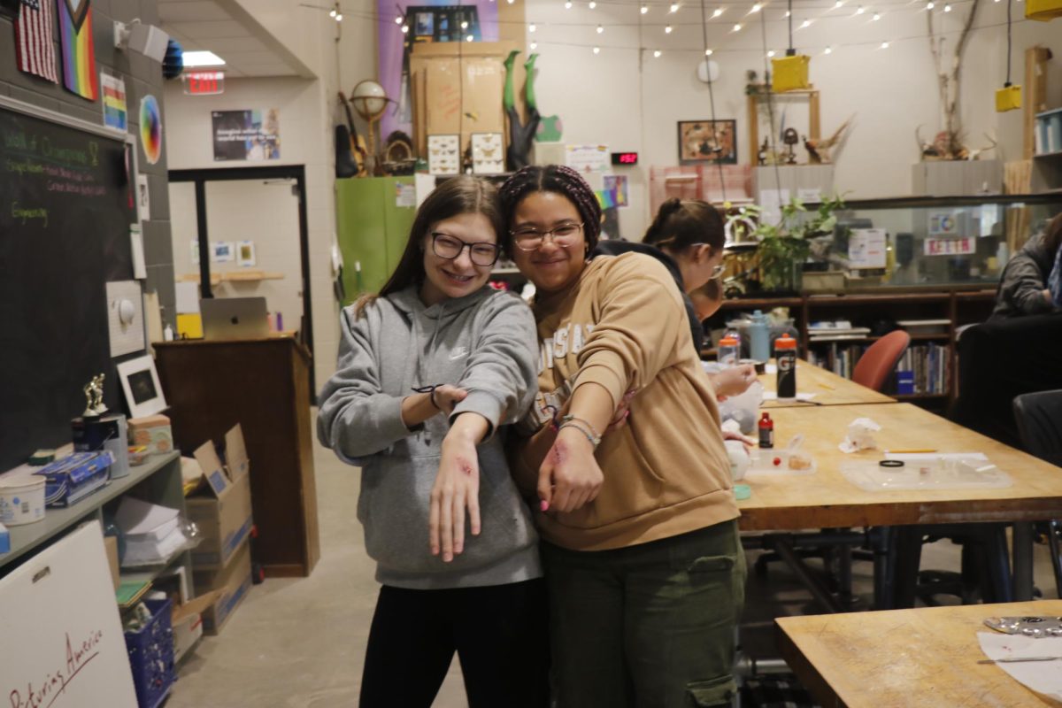 Seniors Lauren Hepker and Cana Safo show of their hard work by posing with their special effect wound makeup! 