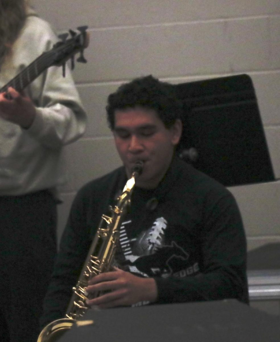 Sophomore Jonathan Winkler plays a solo during a Jazz Band Performance.