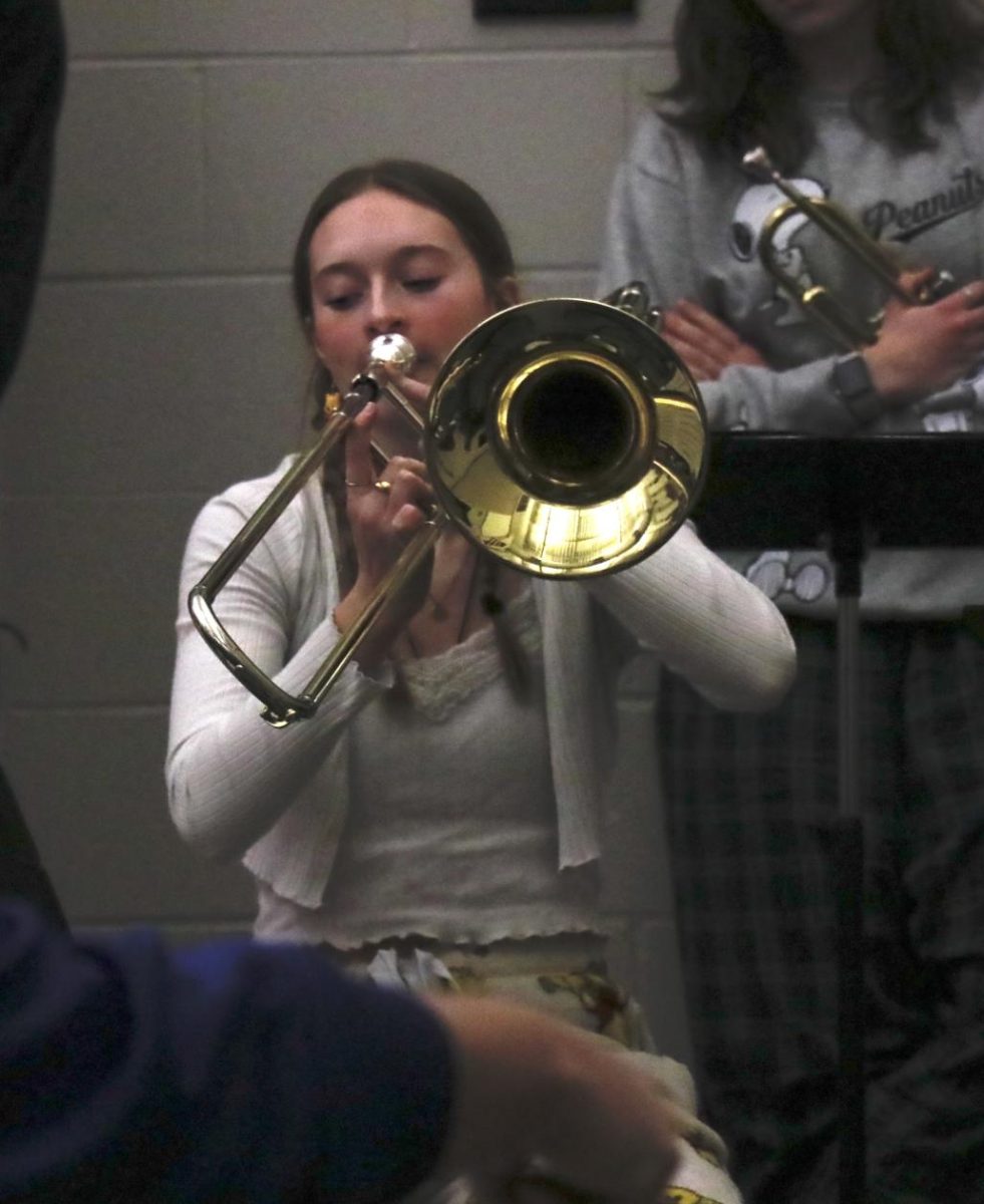 Junior Claire Thuerauf plays her solo during the second song played by the Swinging Stangs.