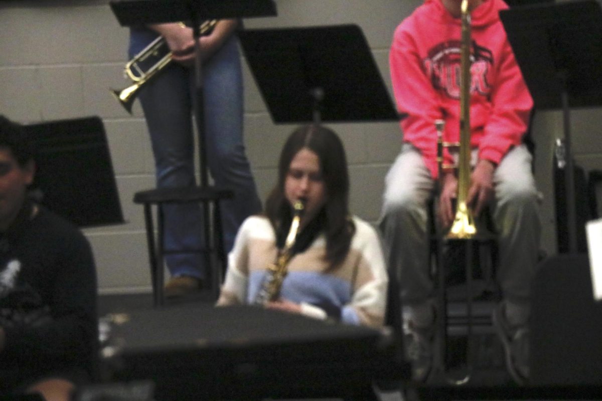 Charlotte Woosley plays her saxophone during a Swinging Stangs performance.