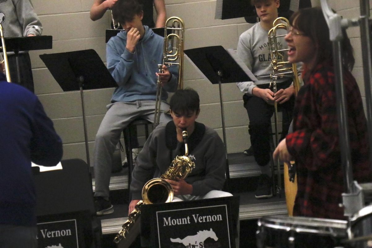 Junior Nolan Pownell plays Baritone Saxophone during a performance for the Baseball and Jazz J-Term.