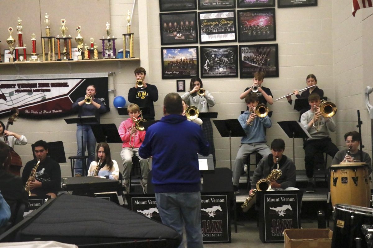 Band Director Scott Weber conducts the Swinging Stangs as a demonstration for the Baseball and Jazz J-Term.