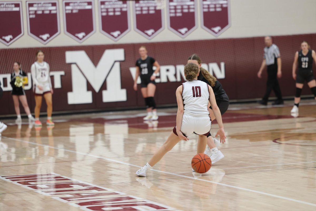 Freshman Savanna Wright (10) dribbles the ball behind her back to avoid her defender, Jan. 15. 