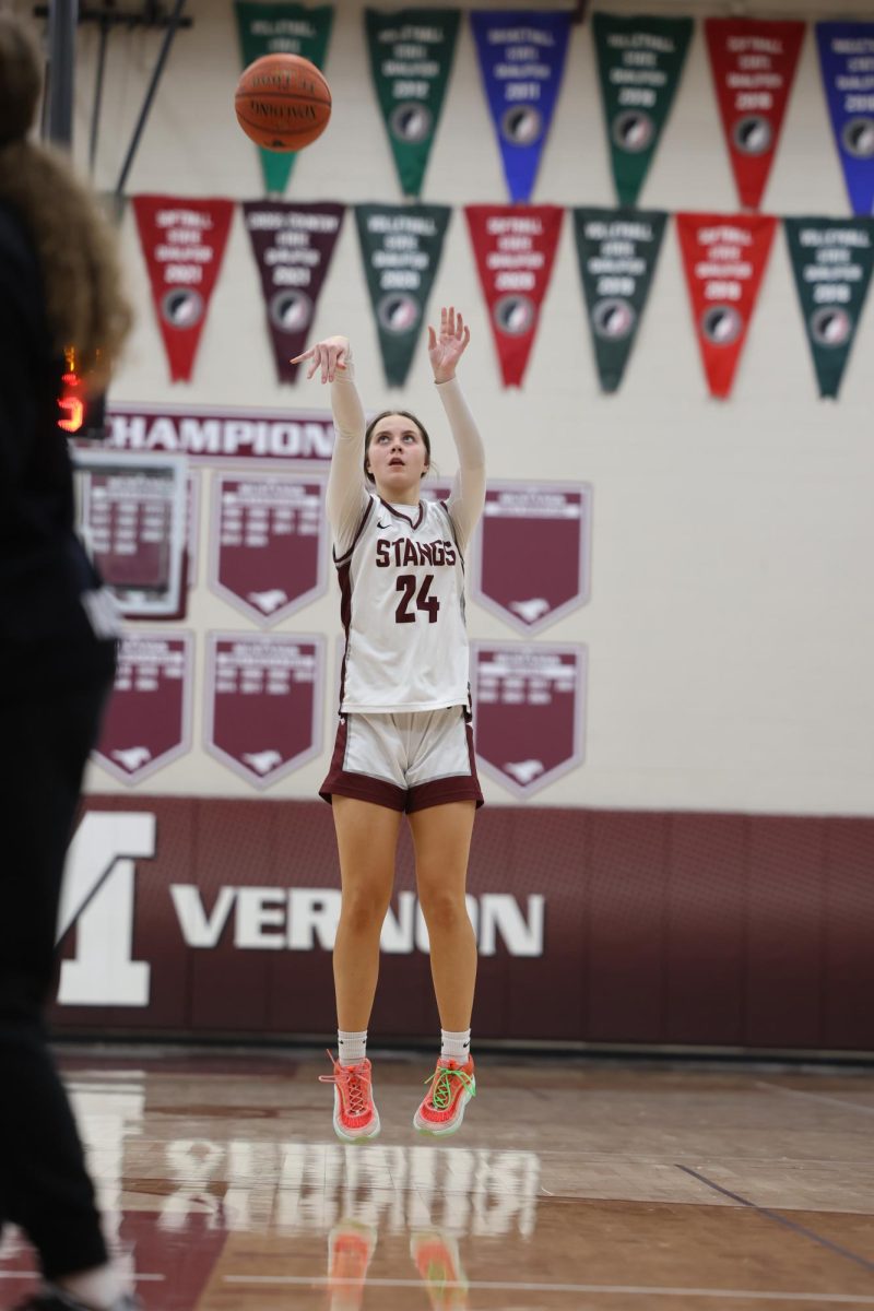 Sophomore Rylee Rasmussen (24) shoots a 3 pointer against Center-Point Urbana, Jan. 15. 