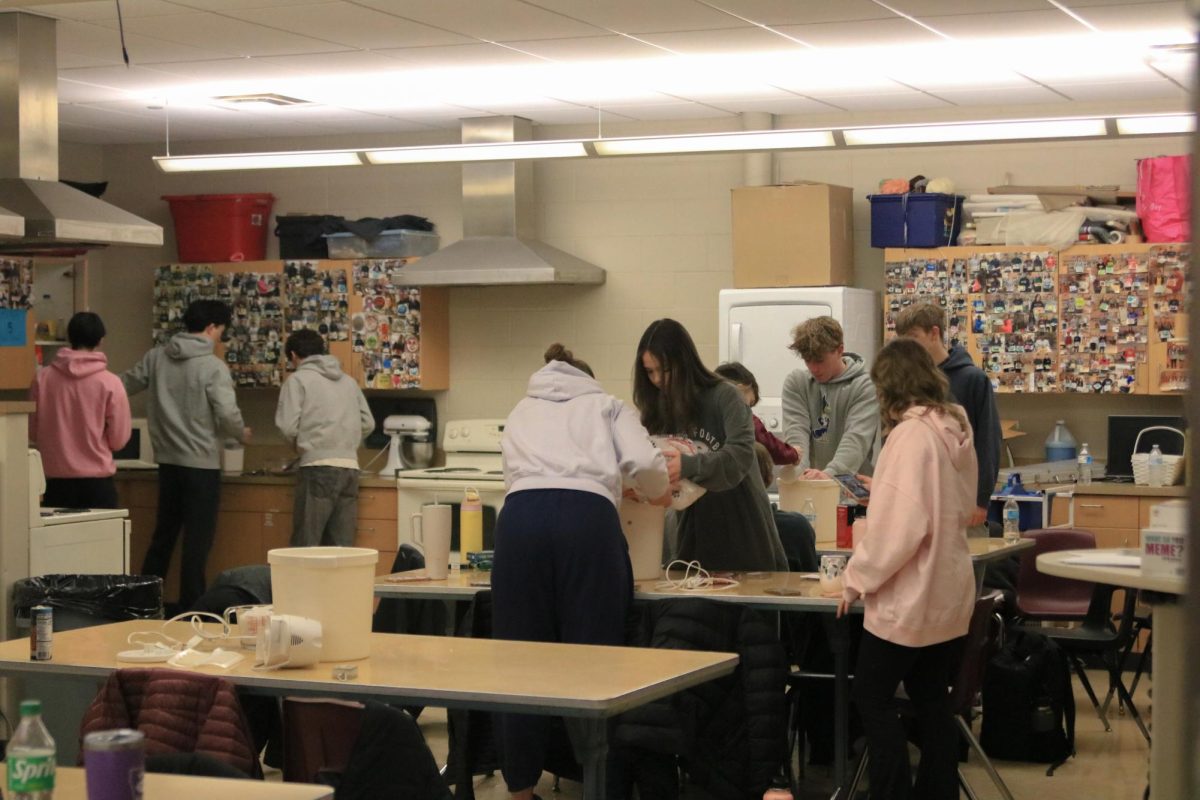 Students in the Farm to Table J-term work together to make ice cream.