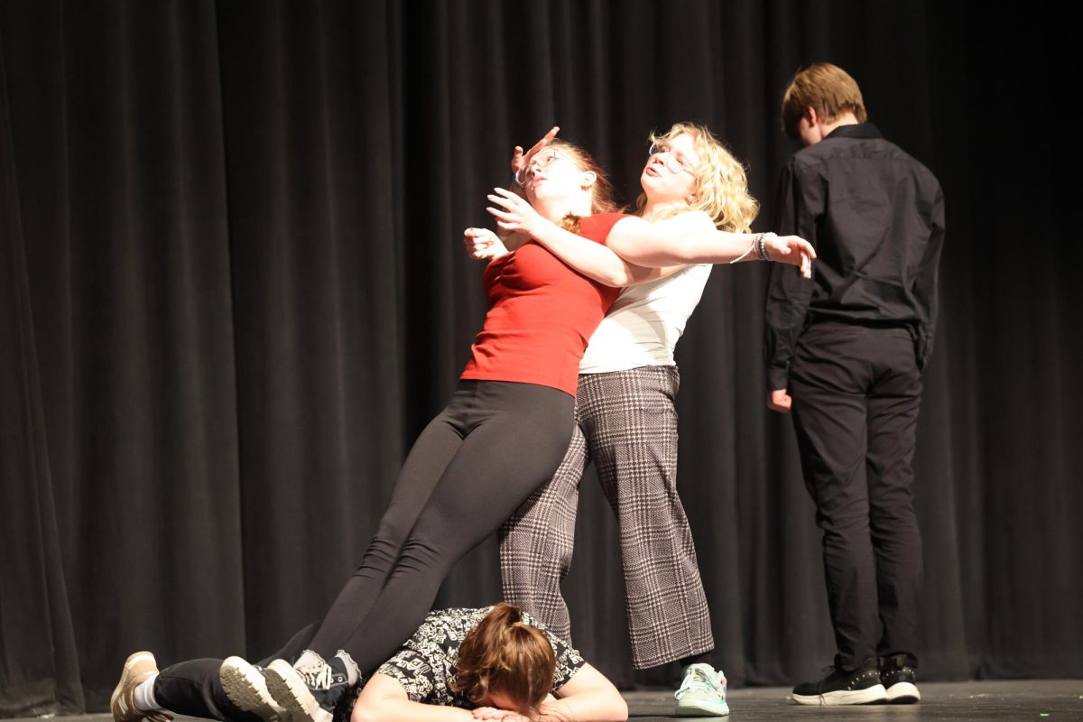 Senior Violet Olinger dies, falling into senior Penelope Vig during the ensemble acting"Hamlet" Feb.15.