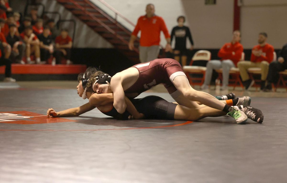 Cooper Krob locks the arm of his opponent from Davenport Assumption to attempt to set up a pin Feb. 4 at regionals. Krob, who usually wrestles at 106, wrestled at 113 to win by fall over Peter Nguyen. Krob's pin gave the team their first 6 points in their 34-31 win over Assumption. Mount Vernon will advance as a team to compete in Class 2A State Duals on Feb. 8 at Xtream Arena in Coralville.