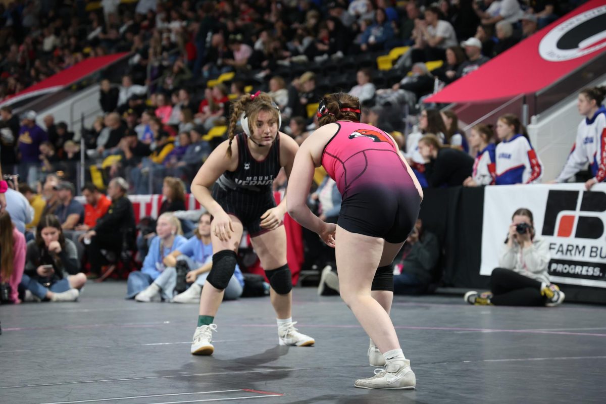 Junior Addi Whisner (145) wrestles her opponent Feb. 7.