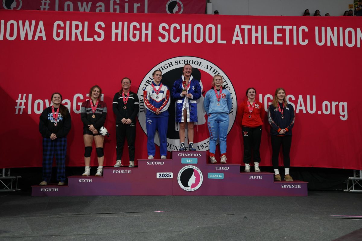 Junior Addi Whisner (145) is on the podium for her 6th place finish at Class 1A State Wrestling.