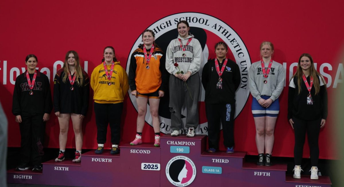 State Champ Libby Dix poses on the podium.