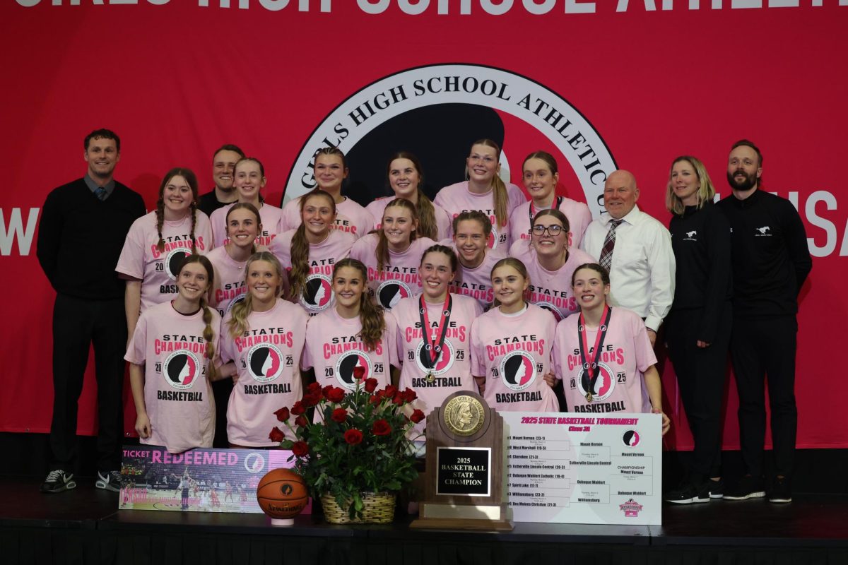 The 3A State Champion Mount Vernon Mustangs pose with the trophy March 7.