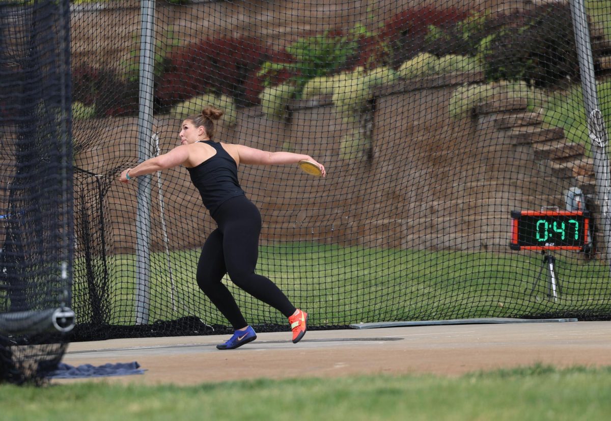 Libby Dix places first in discus with a throw of 148-10.