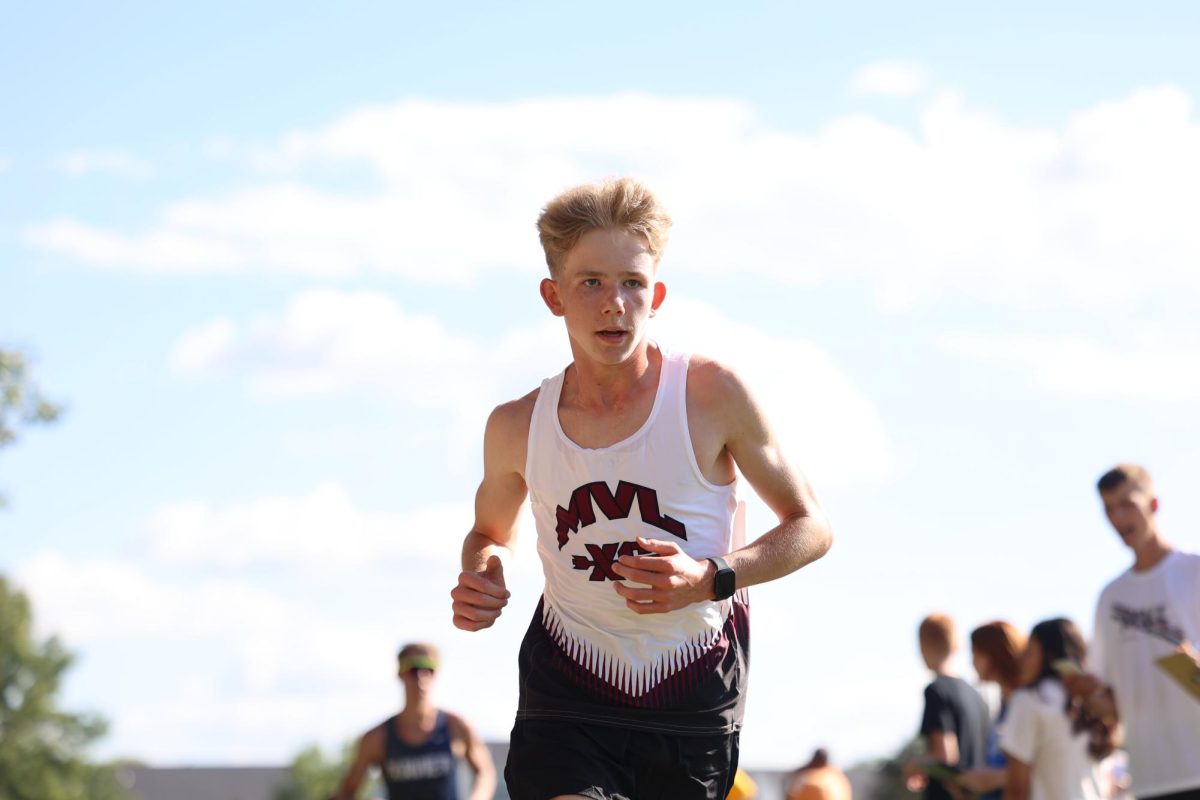 Freshman Benjamin Brinkman concentrates during his race at the home meet.