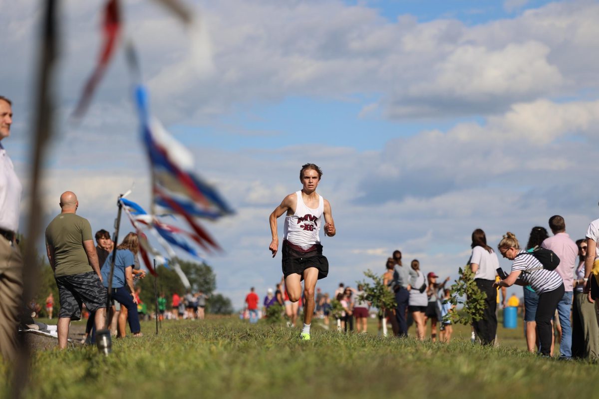 Freshman Charles Rupe races to the finish line during the home meet.
