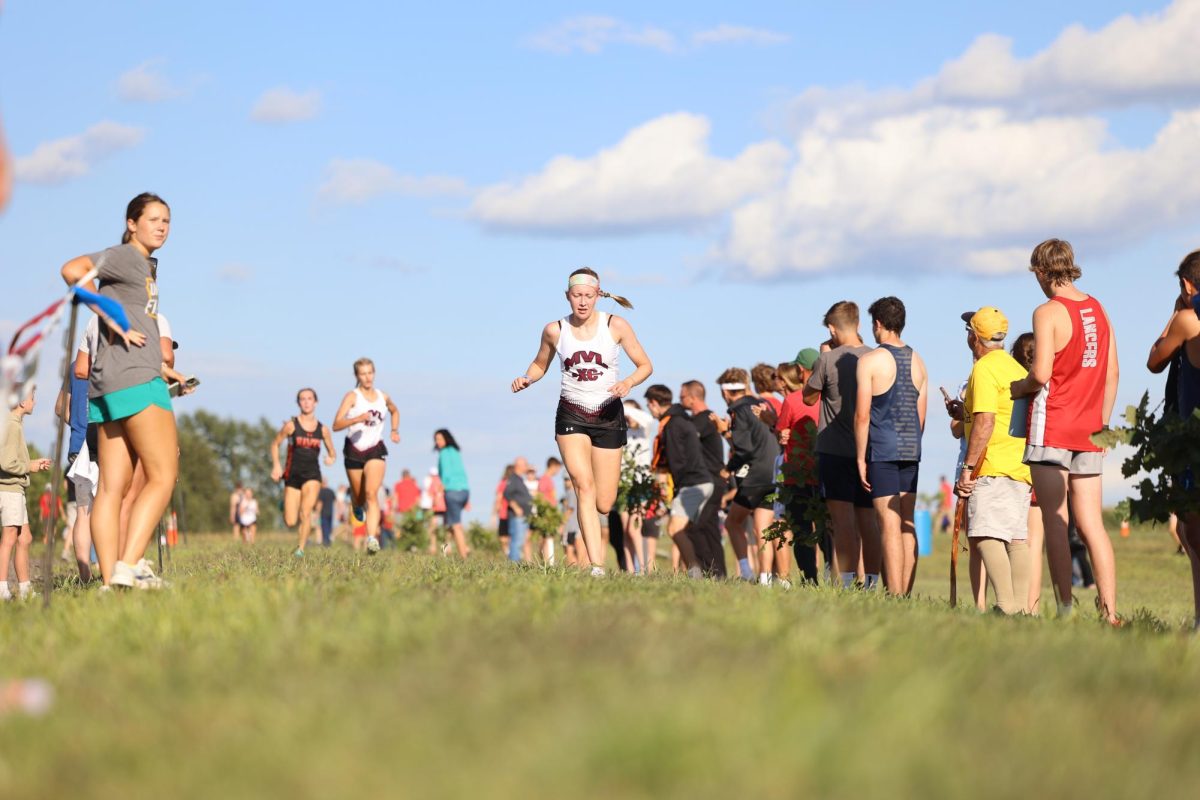 Edith Dawson runs through the shoot to the finish line. 