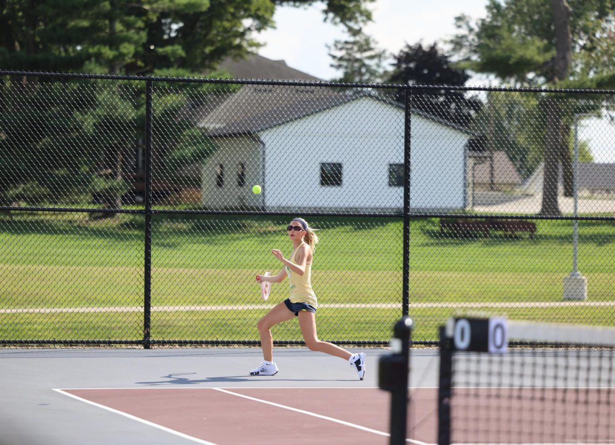 Senior Tallulah Norton get ready to return the ball to her opponent. The Mustangs beat Independence 7-2 Aug. 28. 