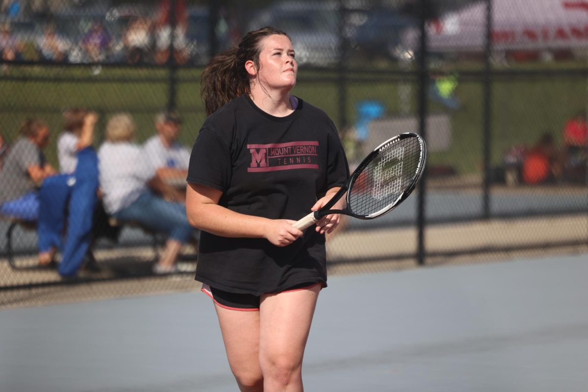 Senior Mae Stoops waits for the ball to be served. The Mustangs beat Independence 7-2 Aug. 28. 
