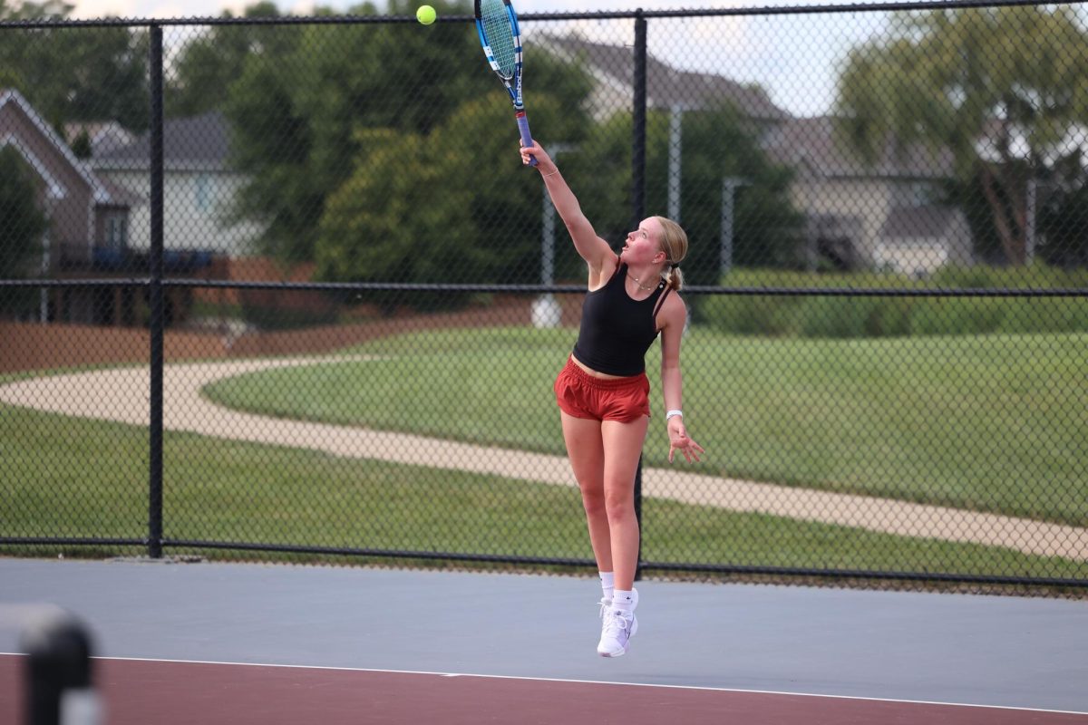 Freshman Stella Dvorak passes the ball back to her opponent. The Mustangs beat Independence 7-2 Aug. 28. 