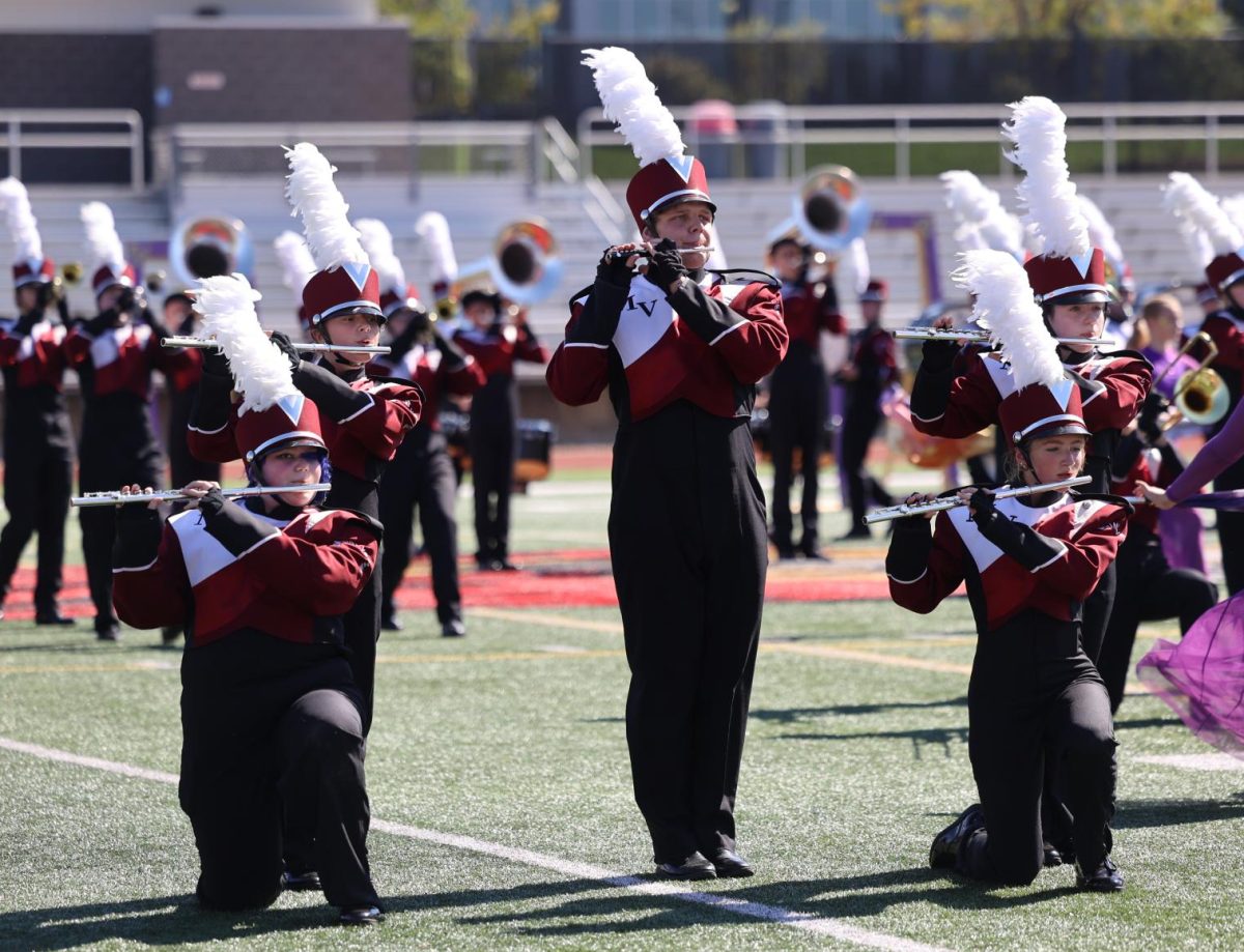 Marching Mustangs' flutes play together during the Linn-Mar band competition.