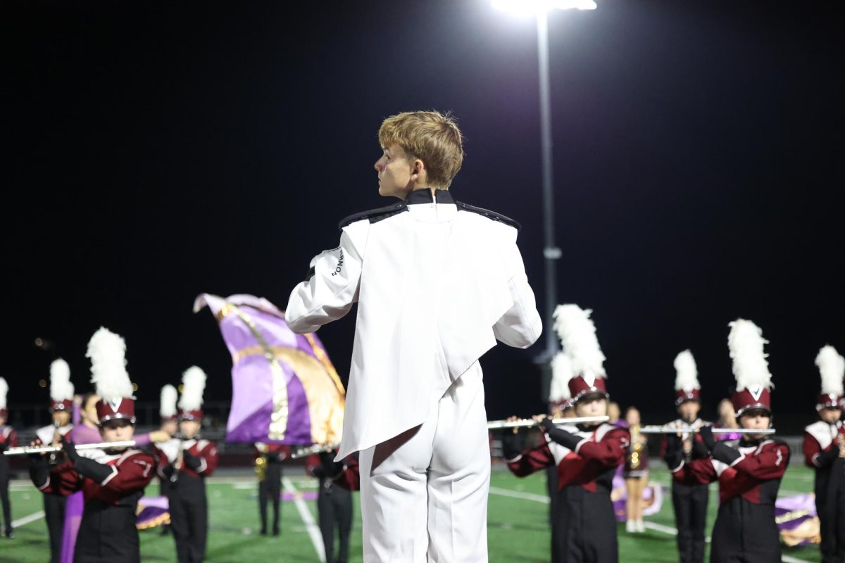 Sophomore Andrew Weber conducts the Marching Mustangs during their performance on Sept. 19.