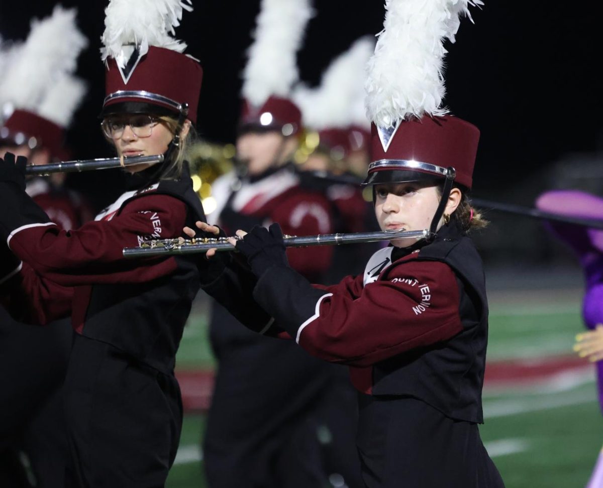 Freshman Jo Barns performs with the marching band during their halftime show on Sept. 19.