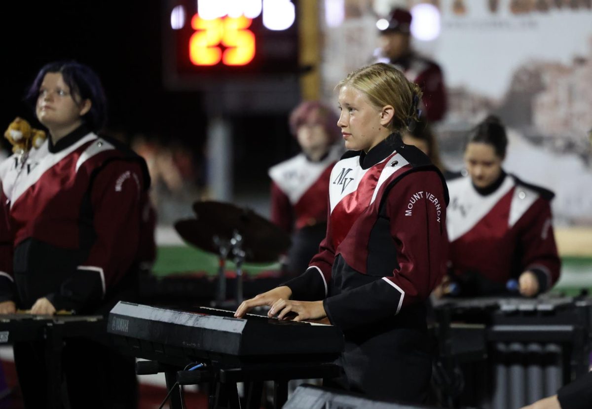 Senior Edith Dawson plays with the pit during the marching band show on Sept. 19. 