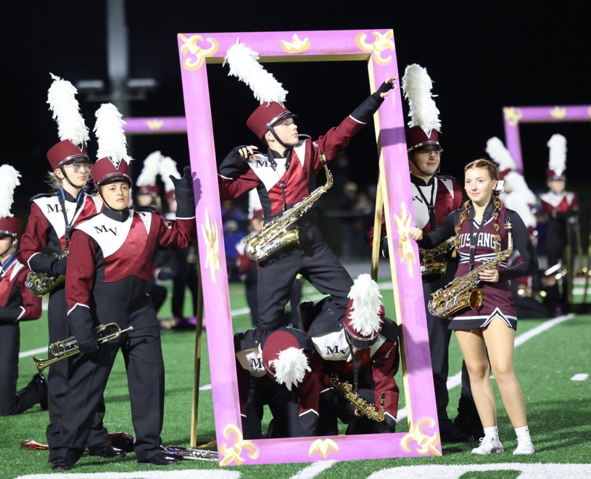 The Marching Mustangs freeze time as they wait to begin their show "Reminisce" on Sept. 5. 