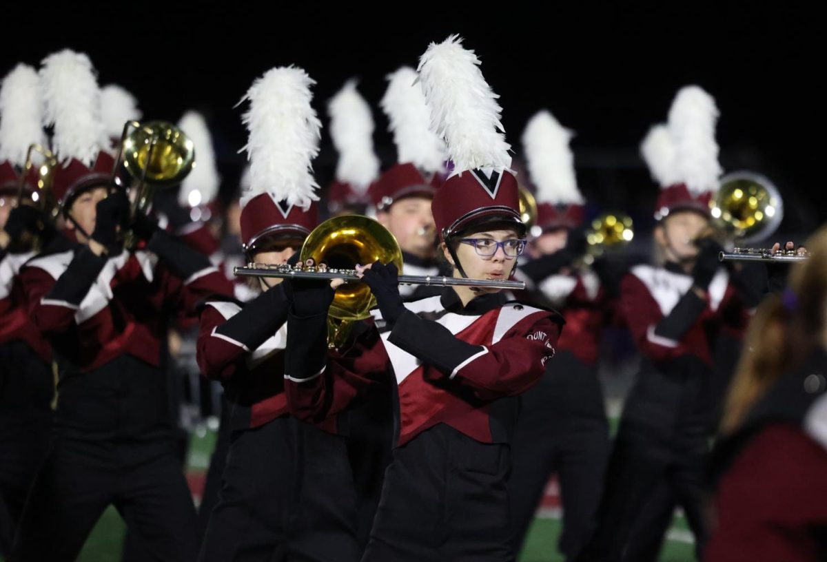 Junior Chris Jones marches with the Marching Mustangs on Sept. 5.