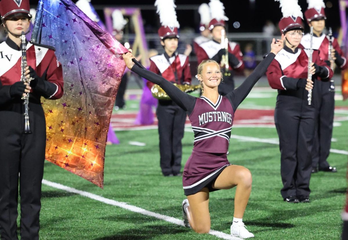 Junior Nora Dye poses during the Marching Mustangs' show on Sept. 5. 