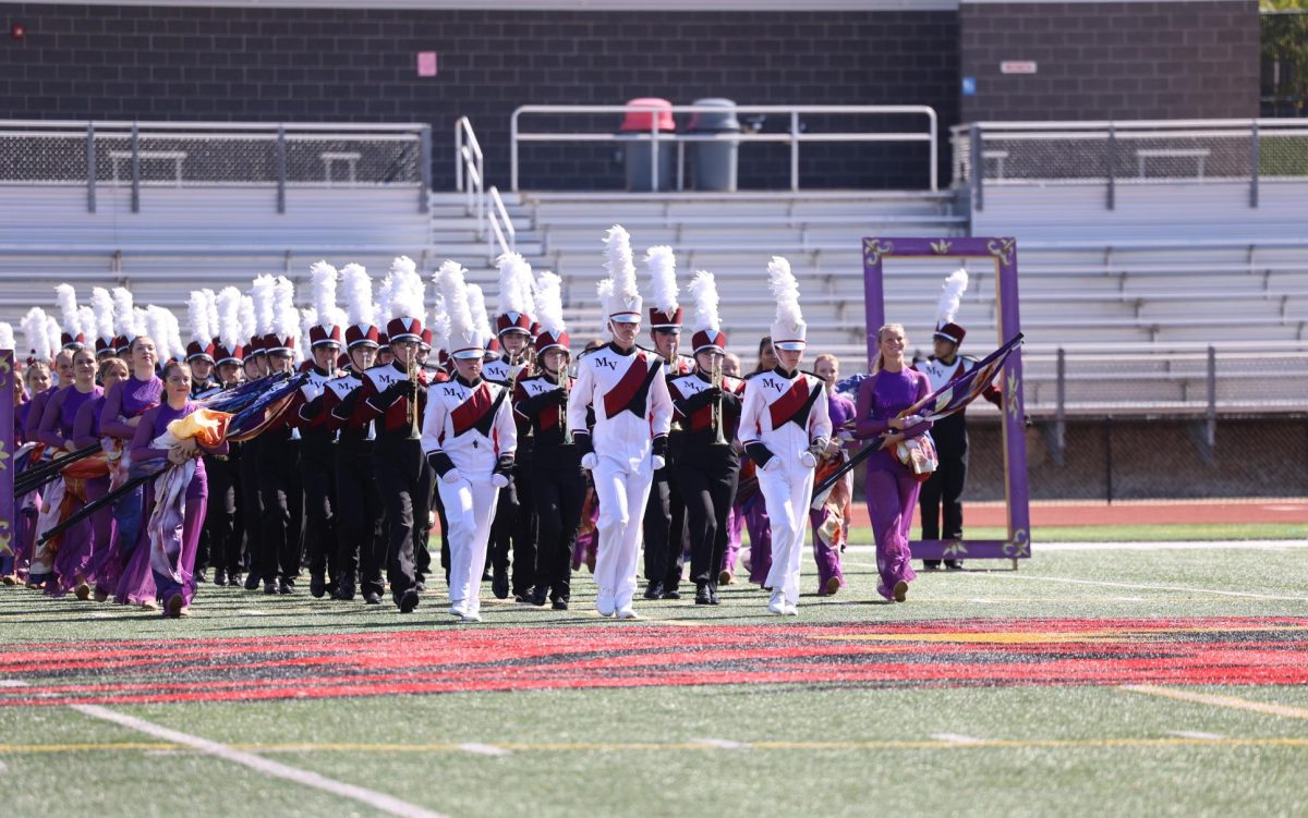 The Marching Mustangs enter the field for their performance at Linn-Mar on Sept. 27. 