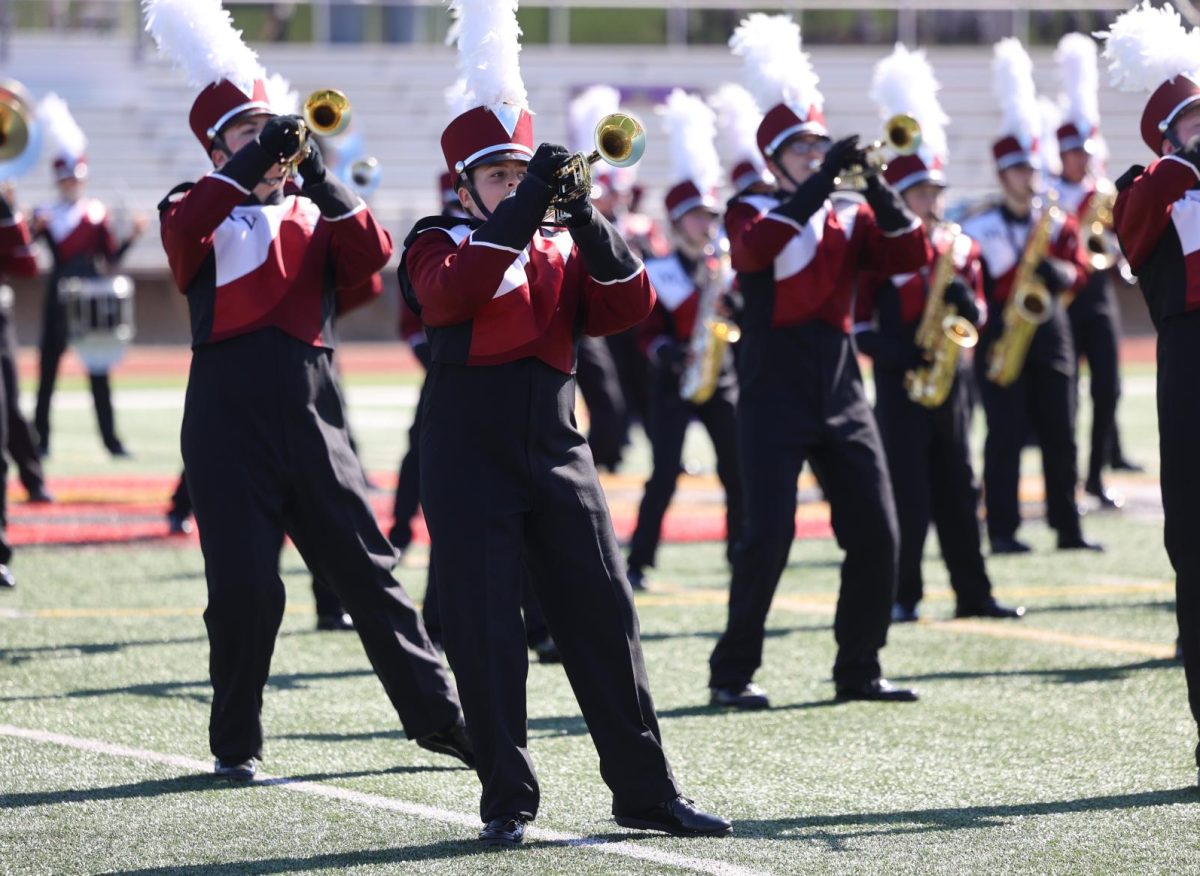 Eighth grader Cam Oesterle performs with the marching band during their competition on Sept. 27. 