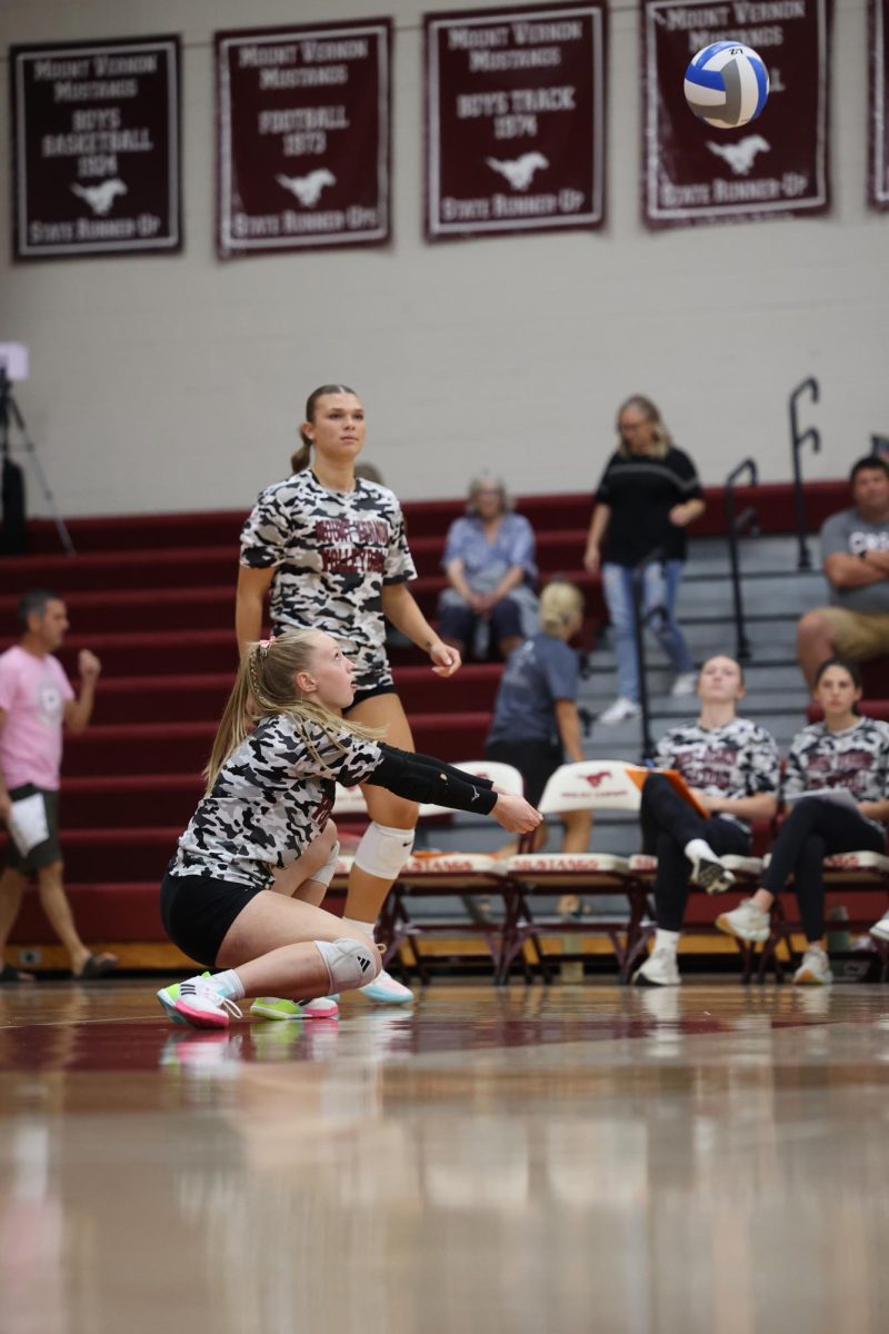 Senior Izzy Logue passes a ball during warmups. 