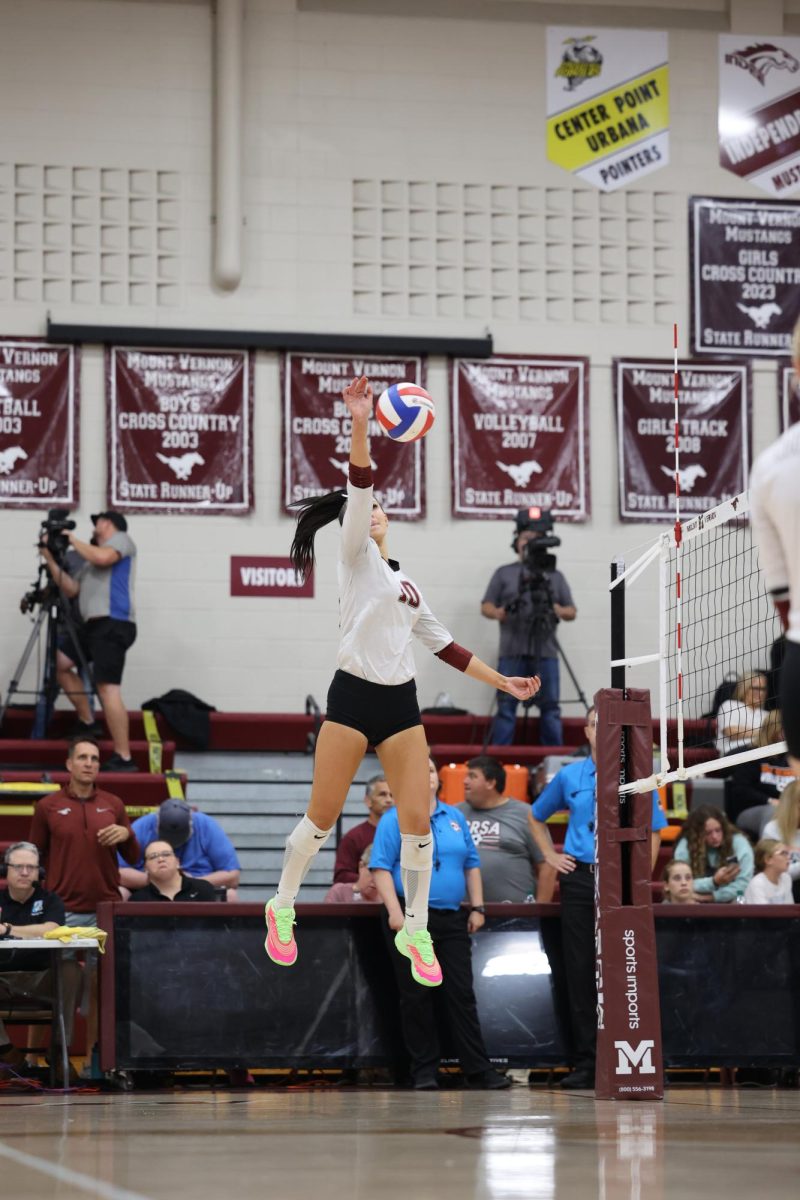 Sophomore Maddy Paulus #10 hits the ball during warm ups against West Delaware on Sept 16.