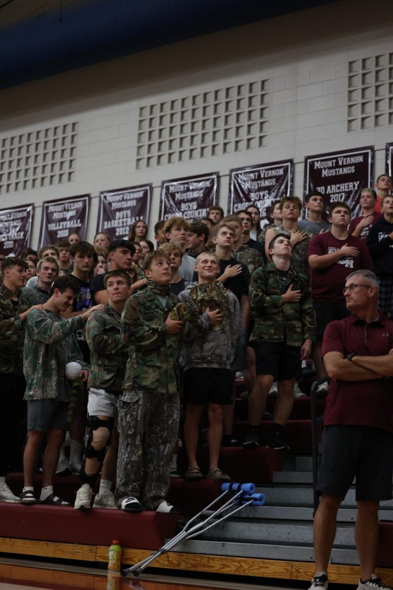Students of the Mount Vernon student section gather for the national anthem. 