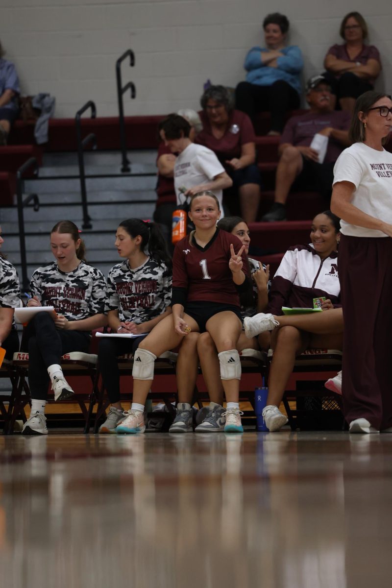 Junior Mavrik Schweer takes a break for an energy ball during her game. 