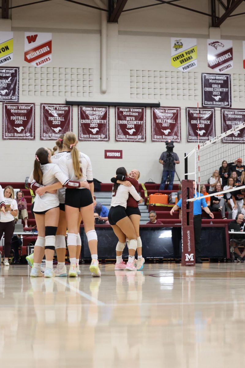 Members of the Mount Vernon Volleyball team celebrate after they defeat 3A #5 West Delaware in 5 sets. 