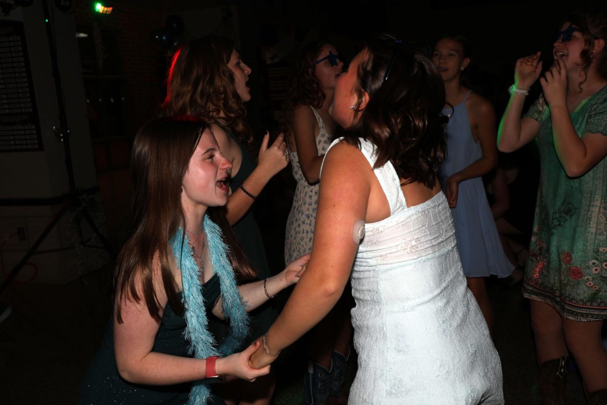 Junior Natalee Glaister and Freshman Jo Barnes dance together at the Homecoming Dance Oct. 4.