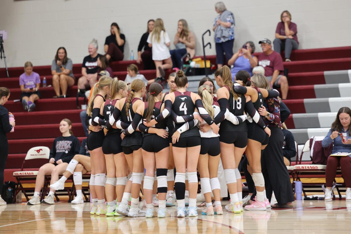 The team talks strategy during a time-out.