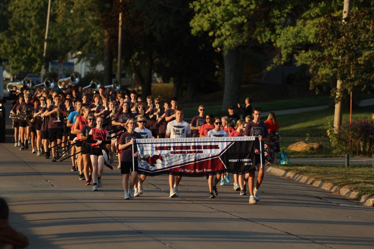 The Marching mustang leads the homecoming Parade.