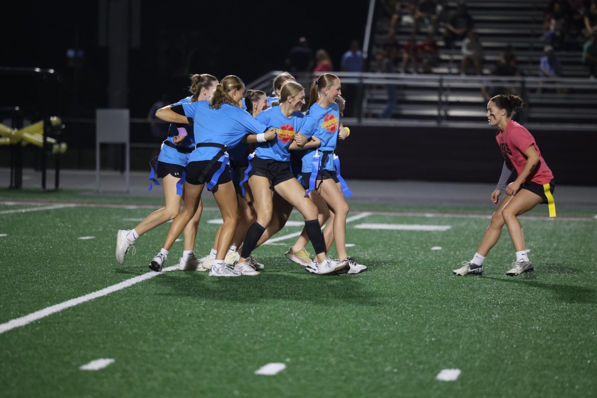 The Surfers create a human shield around the ball carrier Oct. 2.