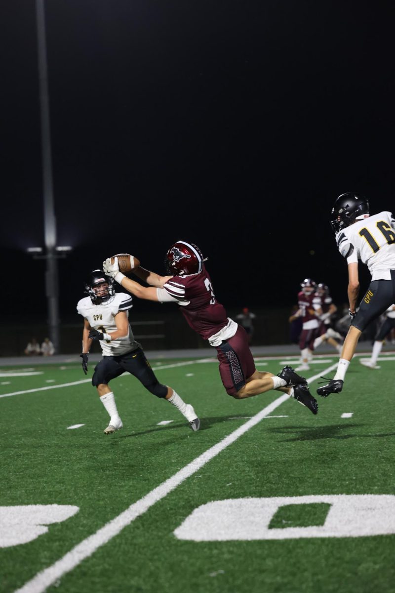 Number 3, Mikey Ryan, catches an overthrown ball on Friday, Oct. 3. 