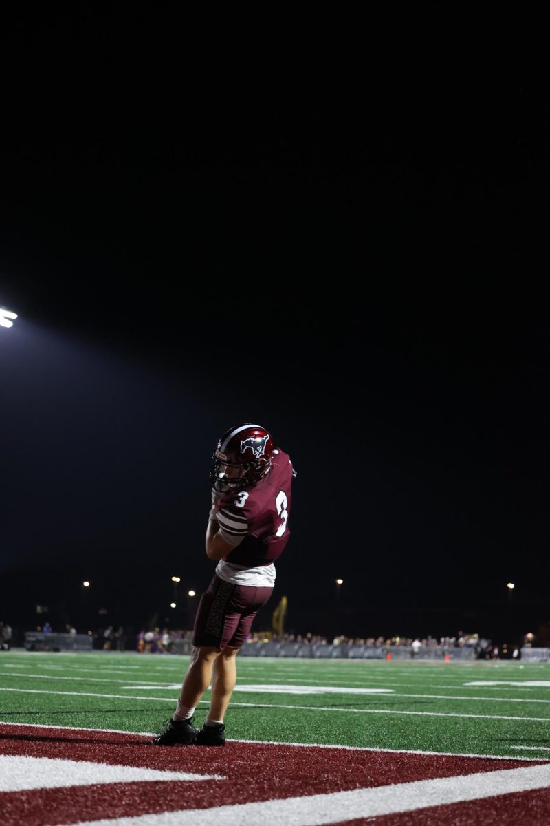 Mikey Ryan (3) ensures that his feet are in the end zone for a touchdown against Center Point-Urbana. 