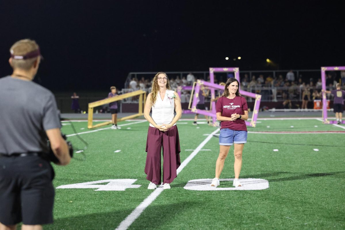 Hall of Fame inductee Renee Meyer Vande Wegge '96 is recognized during the homecoming halftime. Meyer Vande Wegge was inducted for the Fine Arts award. 