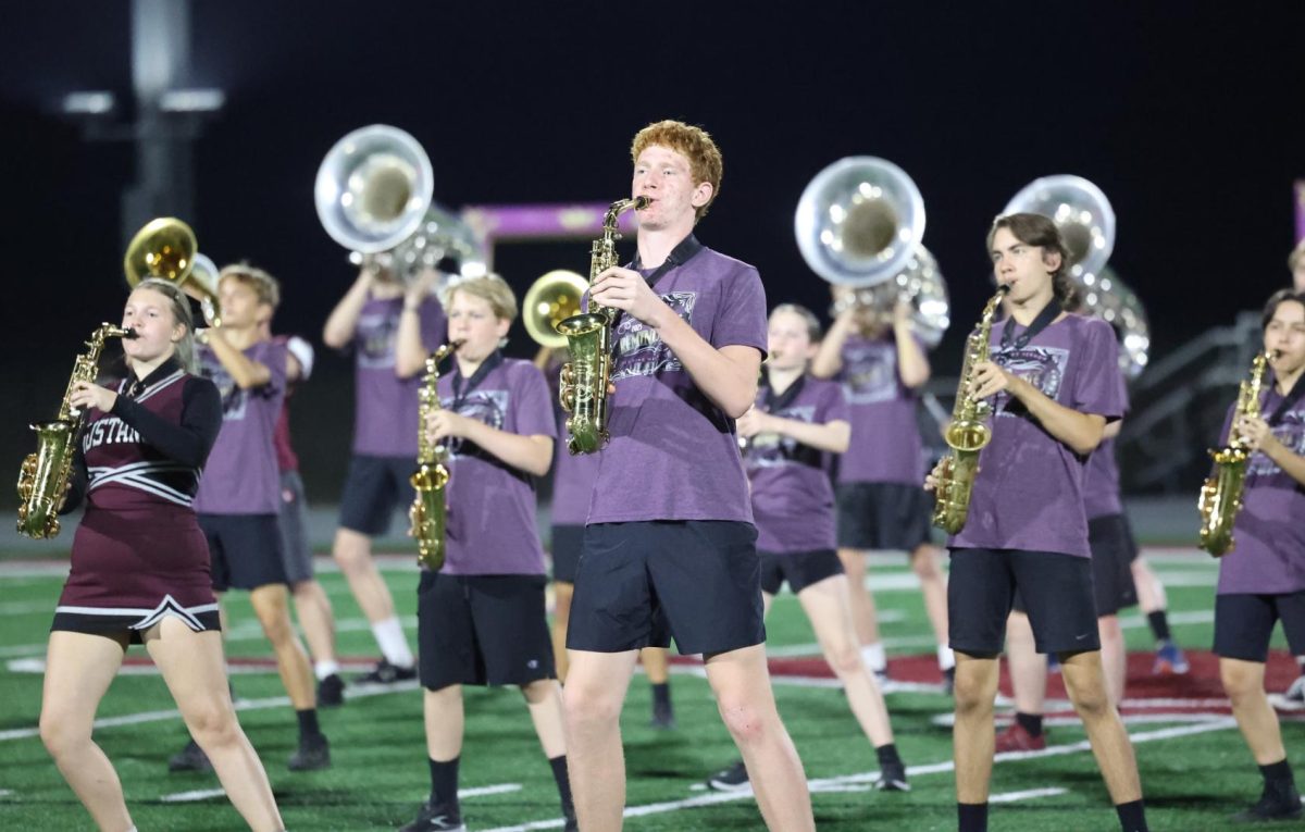 Freshman Mason Bany plays with the saxophone during the Marching Mustangs' performance on Oct. 3. 