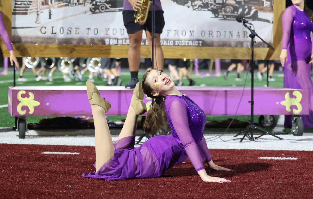 Senior Malena Koehn performs her dance solo during the marching band halftime show. 