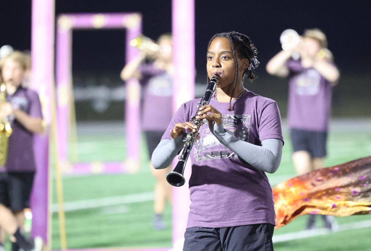 Senior Elena Gehrke marches with the band during the homecoming halftime on Oct. 3.