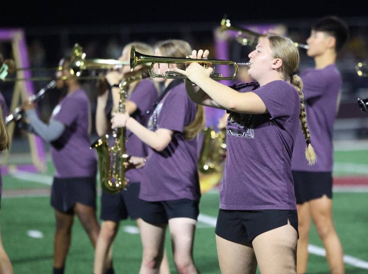 Senior Mya Stoner plays with the marching band during their halftime performance on Oct. 3.